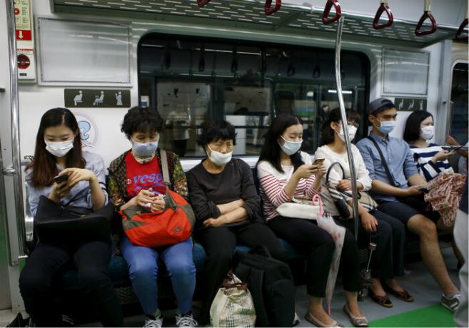People in masks. | Photo: Time Magazine.
