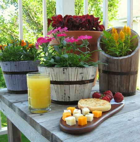 Fresh flowers in wooden tubs are perfect for decorating a Provence style kitchen.