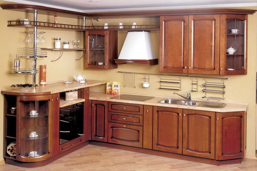 An interesting version of the L-shaped arrangement of the kitchen set using the bar counter