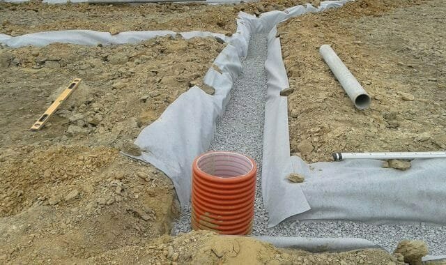 To protect the pipes from clogging earth, sand, and other fine materials, they must be wrapped geotextile