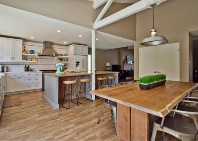 A Scandinavian-style kitchen-living room with a large table will allow the whole family to enjoy a delicious meal