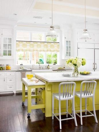 A pastel kitchen with a couple of bright accents