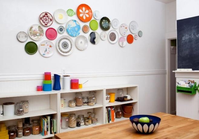 Spices on the shelves, plates on the wall