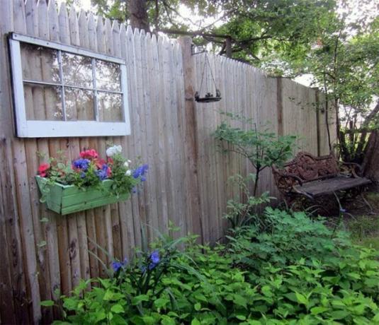 The fence has a functional and decorative purpose at their summer cottage