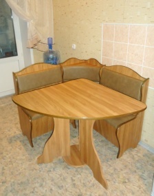 A table and a couch - a triangular shape in this case fits into the space much more urgently than a square table