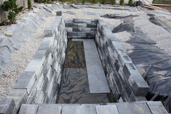 Pool surrounded the decorative stone.