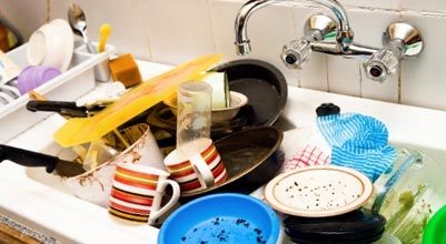 A negligent hostess's sink is always littered with dirty dishes, just like in this photo.