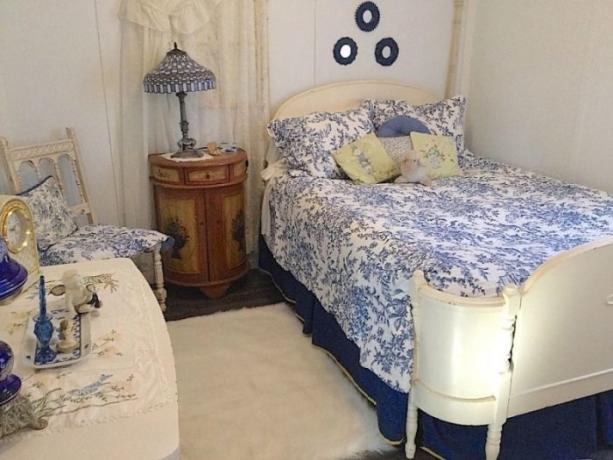 Cozy retro bedroom in white and blue colors.
