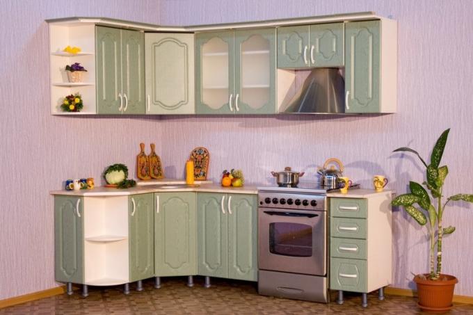 Compact L-shaped set with interesting corner base and top cabinets