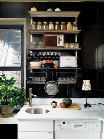 Black kitchen interior in small apartments