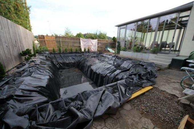 Pit waterproofing material covered pool