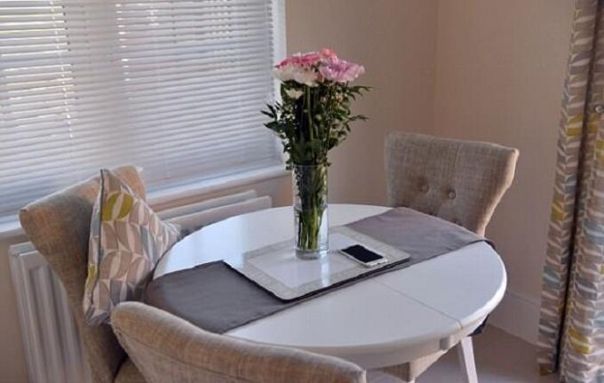 Cute French table adorns the dining room.