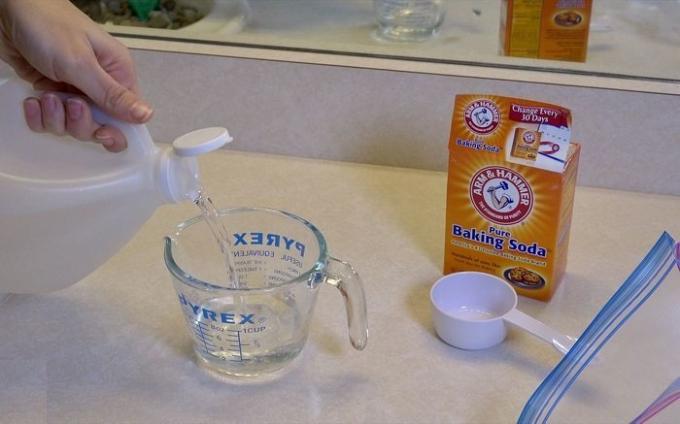 Baking soda and vinegar will help to clean a shower head from limescale.