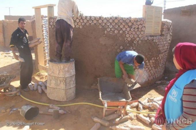 The construction of cheap houses of unusual material.