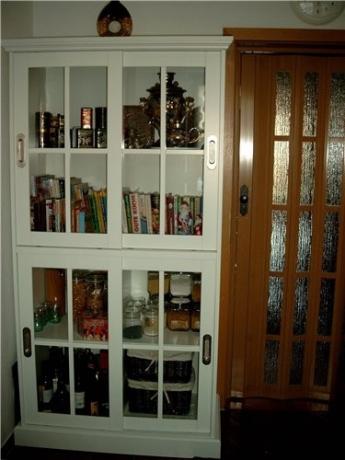 A sideboard in the kitchen, consisting of a solid showcase without a sideboard.